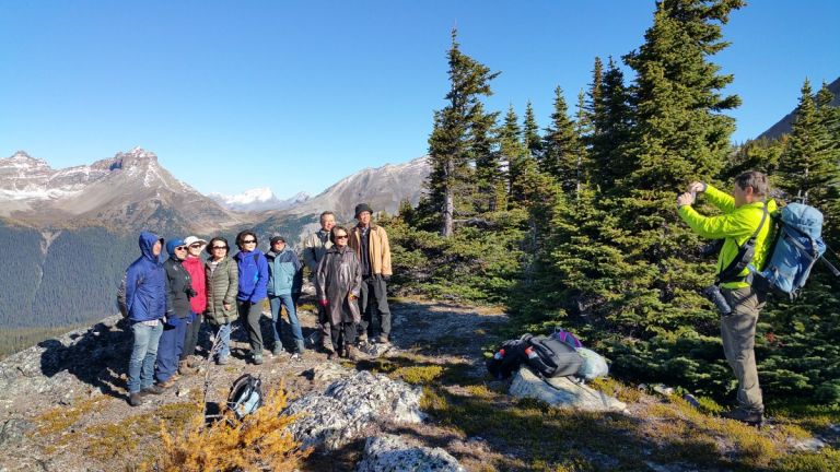 Hikers posing for photo in Canadian Rockies