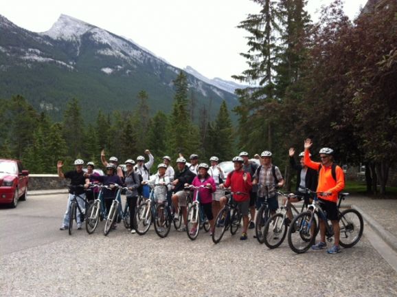 Group of cyclists posing in Canadian Rockies