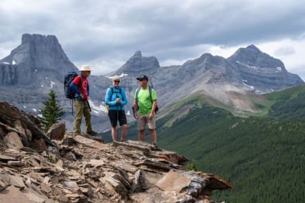 ATV Assisted hikers gain ridgeline overlooking the Canadian Rockies