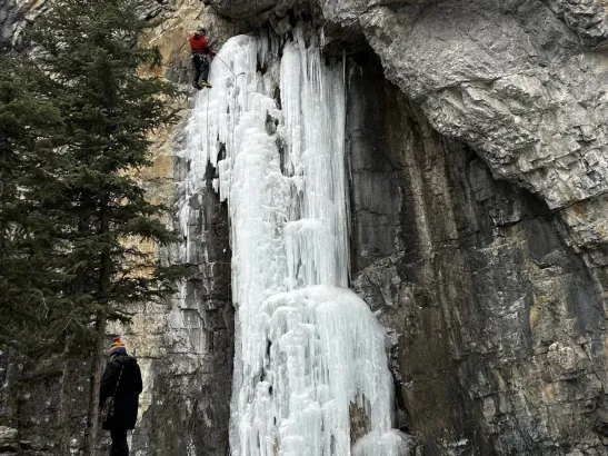 Winter ice climbing on Grotto Canyon frozen falls