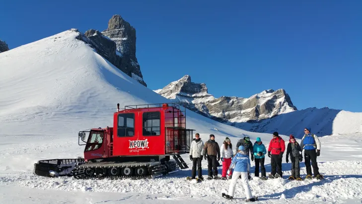 Snowshoers with snowcat at Fortress Mountain