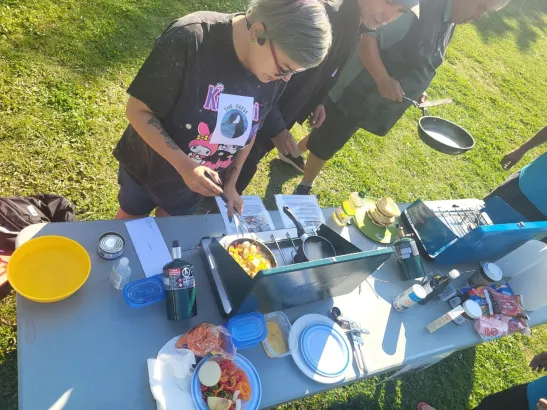 Teams preparing dishes  at Backcountry Iron Chef teambuilding activity, Banff and Canmore Canadian Rockies