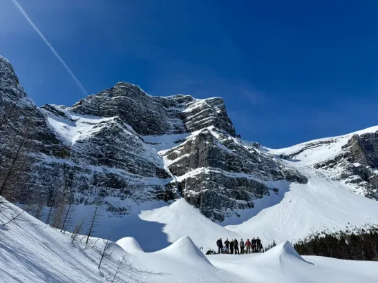 Winter tour group at Fortress Mountain overlooking surrounding mountains