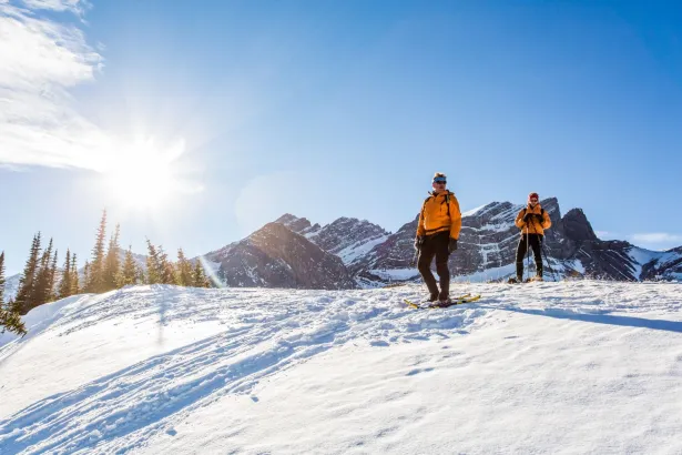 Two people snowshoeing on Fortress Mountain in winter