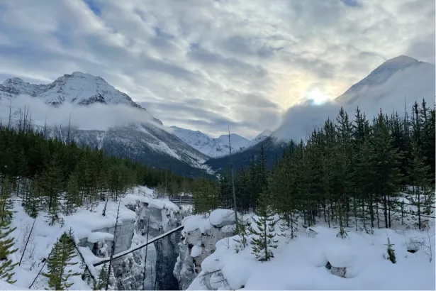 Scenic view of Marble Canyon ice formations and rugged canyon walls with mountains on the horizon