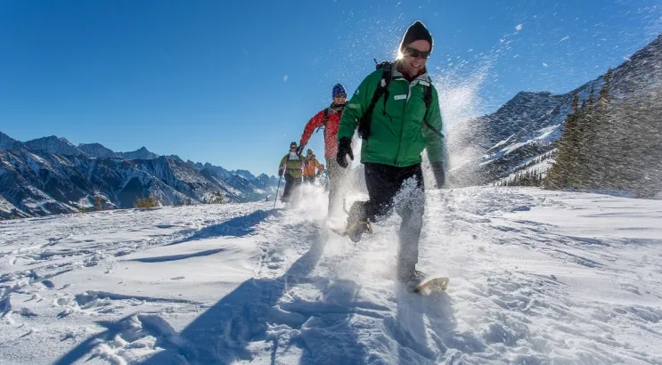 Snowshoers running at Fortress Mountain Resort